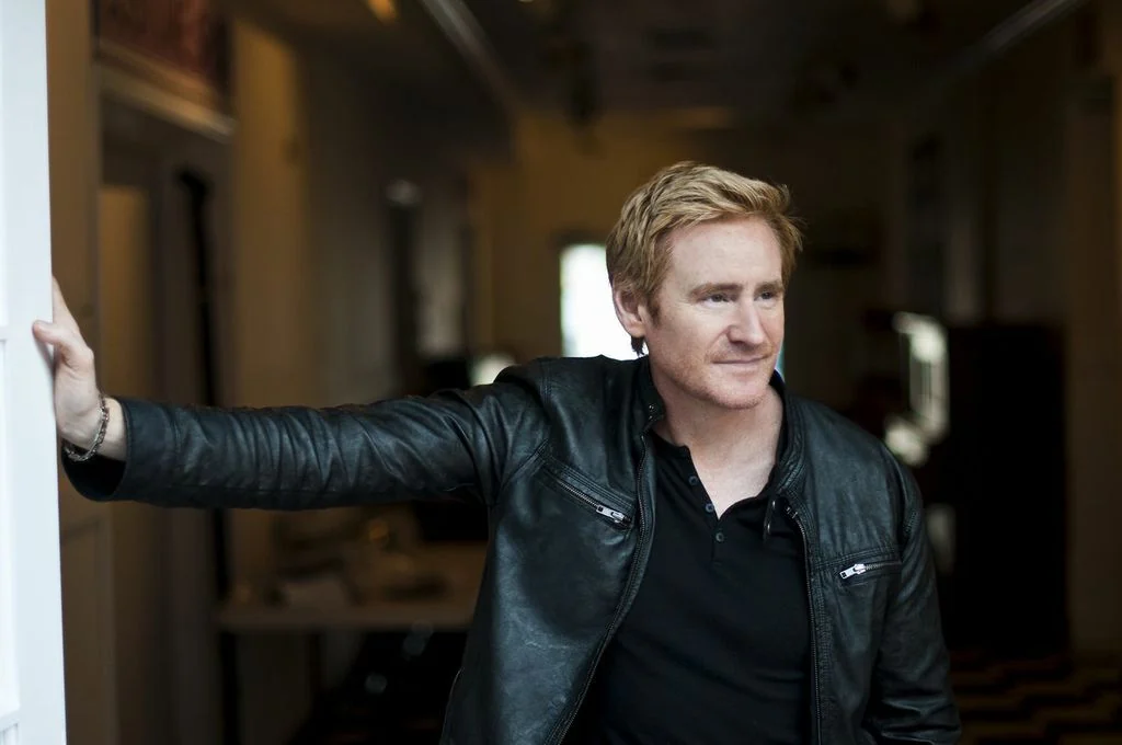 Bart Shatto in a leather jacket in an urban setting